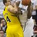Michigan freshman Mitch McGary collides with Michigan State senior Derrick Nix as he attempts to pass during the first half at Breslin Center in East Lansing on Tuesday, Feb. 12. Melanie Maxwell I AnnArbor.com